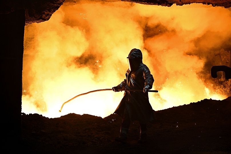 FILE: A worker stands at a blast furnace at the Thyssenkrupp Steel factory in Duisburg, December 2024