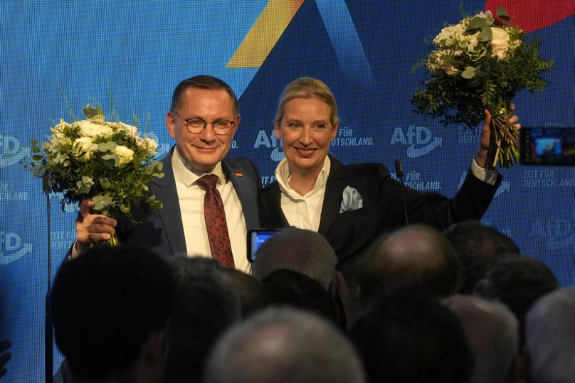 Leaders of far right AfD Alice Weidel and Tino Chrupalla address their supporters at the AfD party headquarters in Berlin, Germany, Sunday, Feb. 23, 2025,