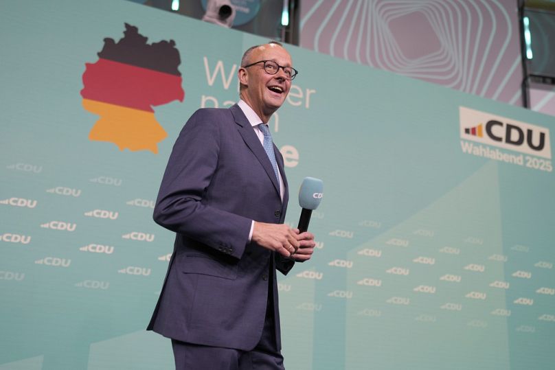 Friedrich Merz, the candidate of the mainstream conservative Christian Democratic Union party, arrives on stage to address supporters at the party headquarters in Berlin, Germ