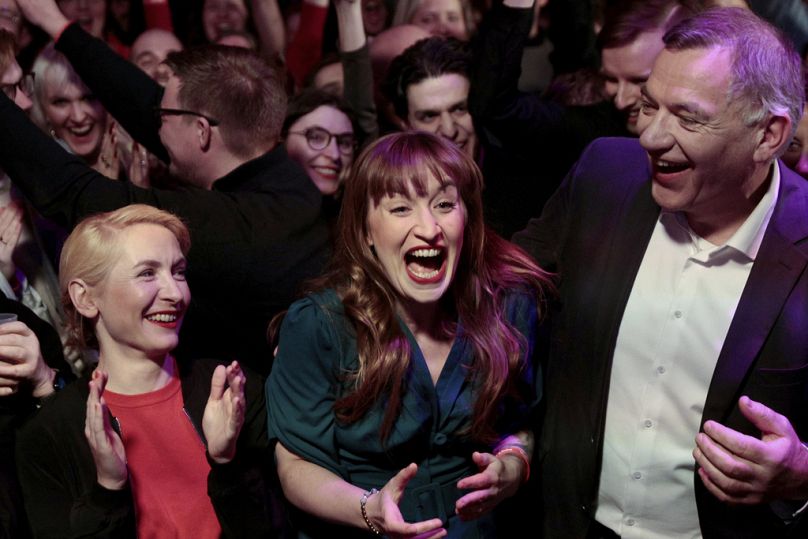 Ines Schwerdtner, co-leader of the Left Party, top candidate Heidi Reichinnek and Jan van Aken, co-leader react during the party's election party in Berlin, Feb. 23, 2025. 