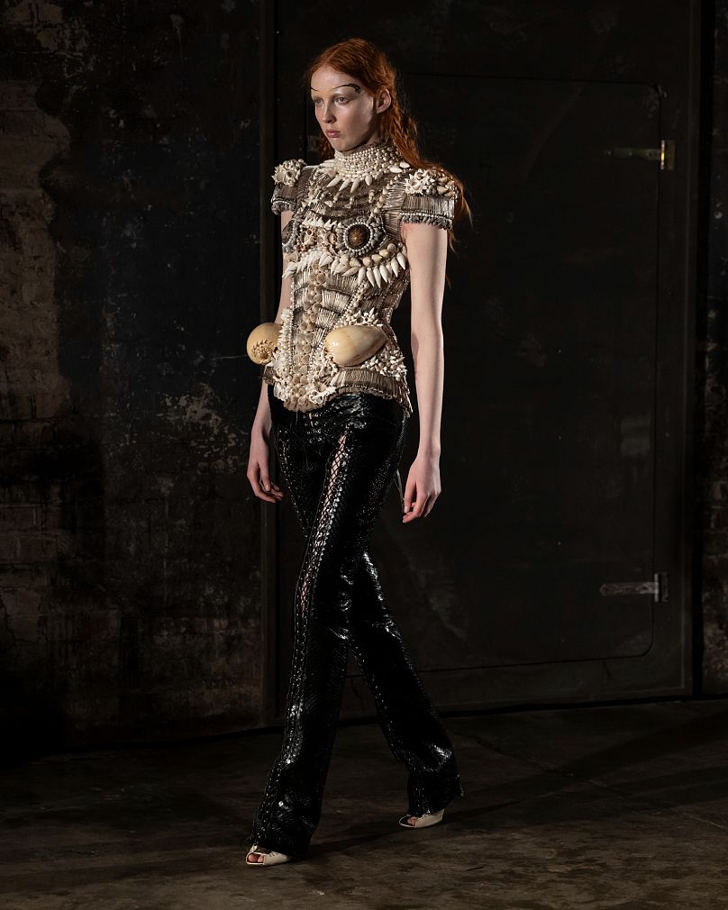 A model showcases a creation from Dilara Findikoğlu's Autumn/Winter ready-to-wear collection at London Fashion Week.