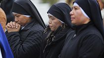 People pray for Pope Francis in front of the Agostino Gemelli Polyclinic, where the Pontiff has been hospitalized since Feb. 14, in Rome, Wednesday, Feb. 26, 2025.