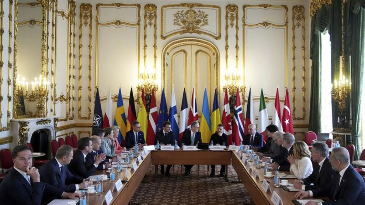 arafed view of a meeting room with a large table full of people