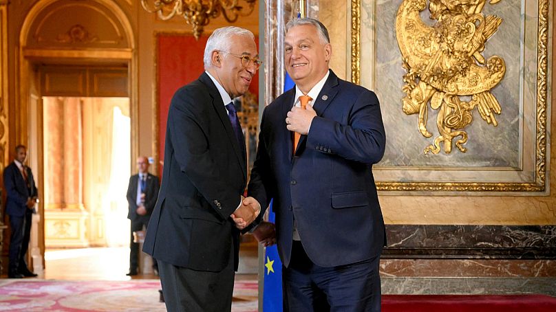 European Council President Antonio Costa, left, greets Hungary's Prime Minister Viktor Orban as he arrives for an EU summit at the Egmont Palace in Brussels, Feb. 3, 2025.
