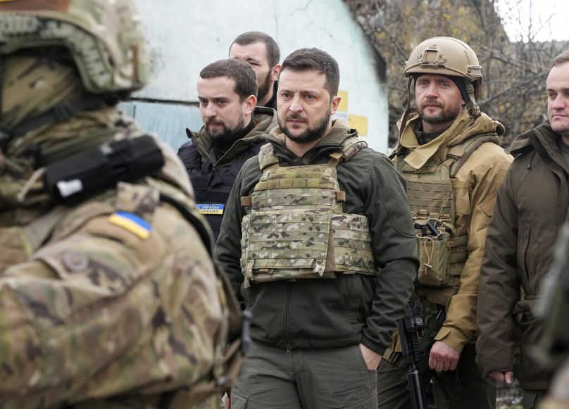 Ukrainian President Volodymyr Zelenskyy examines the site of a recent battle in Bucha close to Kyiv, Ukraine.