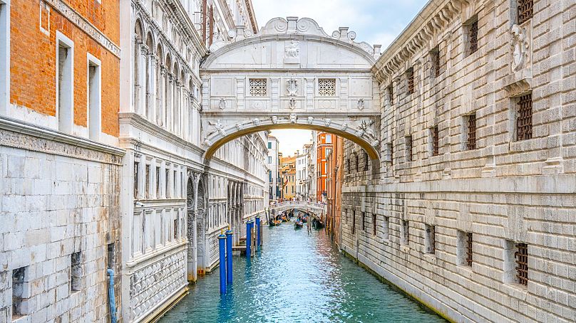 Take a gondola ride under the famous Bridge of Sighs in Venice