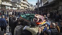 Relatives and neighbours attend funeral procession for four Syrian security force members killed in clashes with loyalists of ousted President Bashar Assad in coastal Syria