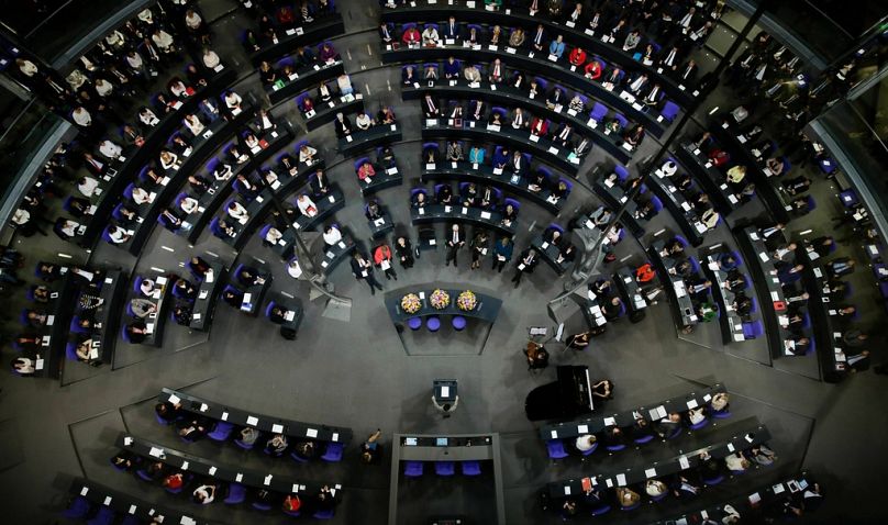 German lawmakers attend a special parliament session at the Reichstag building, host of the German federal parliament, Bundestag, in Berlin, January 2019