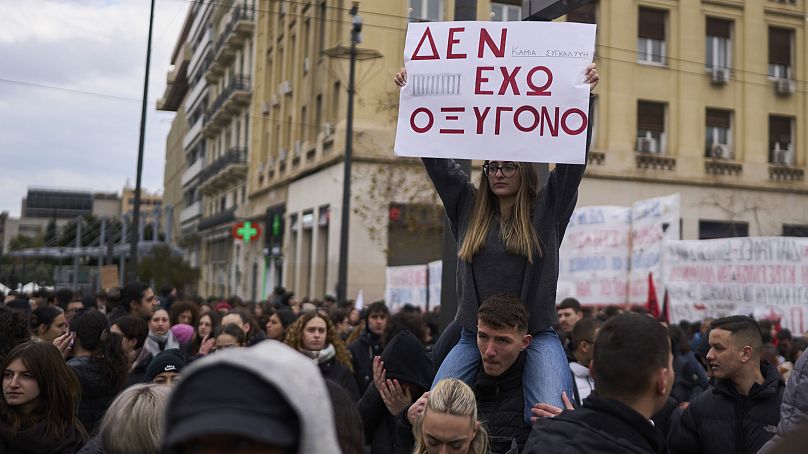 A student holds a placard which read in Greek "I have no Oxygen" during a previous protest against government handling of Tempi rail crash, February 7, 2025.