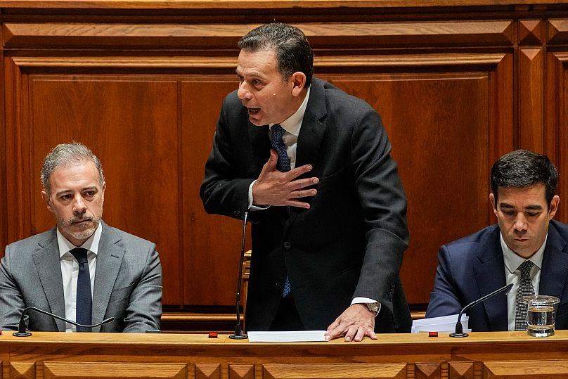 Portuguese Prime Minister Luís Montenegro talks during a debate preceding a confidence motion vote at the Portuguese parliament in Lisbon, 11 March, 2025