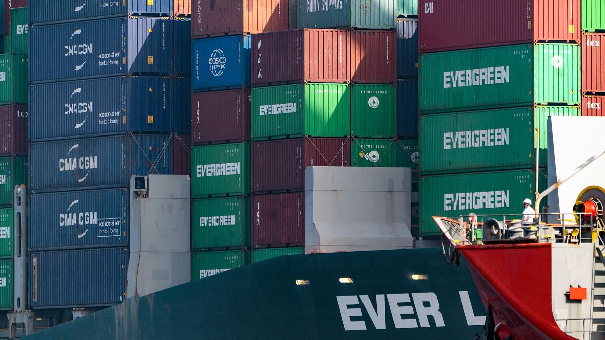 Shipping containers are seen stacked on the Evergreen terminal at the Port of Los Angeles in San Pedro, California. 30 November 2021.