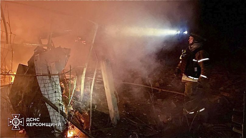 Fire crews after a Russian guided air bombs attack in Kherson, Ukraine, Saturday, March 15, 2025. (Ukrainian Emergency Service via AP)