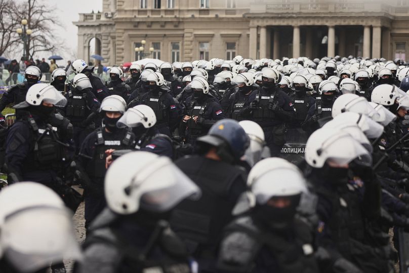 Anti-riot police cordons off the area near the Parliament building in downtown Belgrade, Serbia, Saturday, March 15, 2025. 