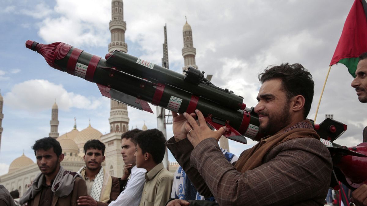 A Houthi supporter holds a mock missile during a protest marking Jerusalem Day in support of Palestinians in the Gaza Strip, in Sanaa, Yemen, April 5, 2024. 