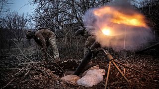 In this photo taken on March 16, 2025 and provided by Ukraine's 24th Mechanized Brigade press service, Ukrainian soldiers fire 120mm mortar towards Russian army positions. 