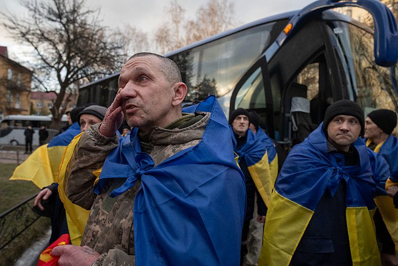 Ukrainian servicemen react after returning from captivity during a POWs exchange between Russia and Ukraine in Chernyhiv, 19 March, 2025