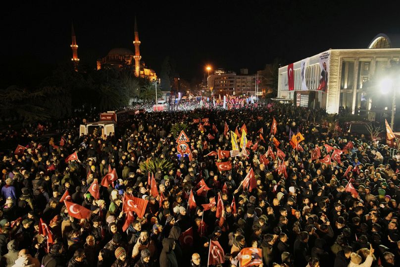 People gather outside the City Hall to protest the arrest of Istanbul Mayor Ekrem Imamoglu in Istanbul, Turkey, Wednesday, March 19, 2025. 