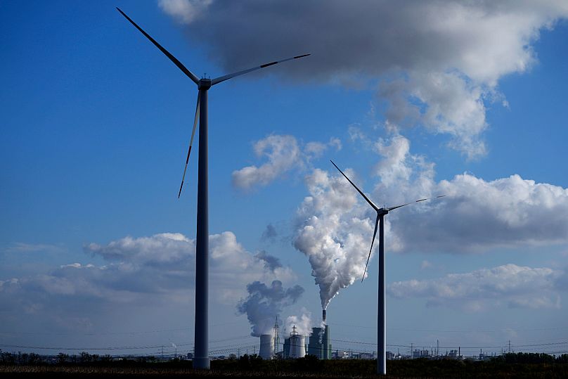 The Schkopau coal-fired power plant operates near wind turbines in Teutschenthal, 15 October, 2024