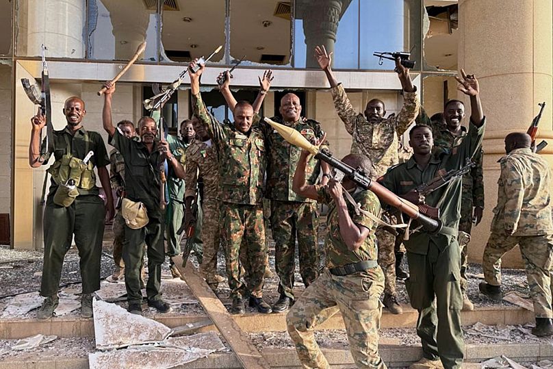 Sudanese soldiers celebrate after taking over the Republican Palace in Khartoum, 21 March, 2025