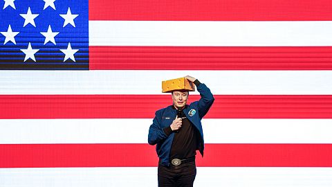 Elon Musk wears a cheesehead during a town hall Sunday, March 30, 2025, in Green Bay, Wis.