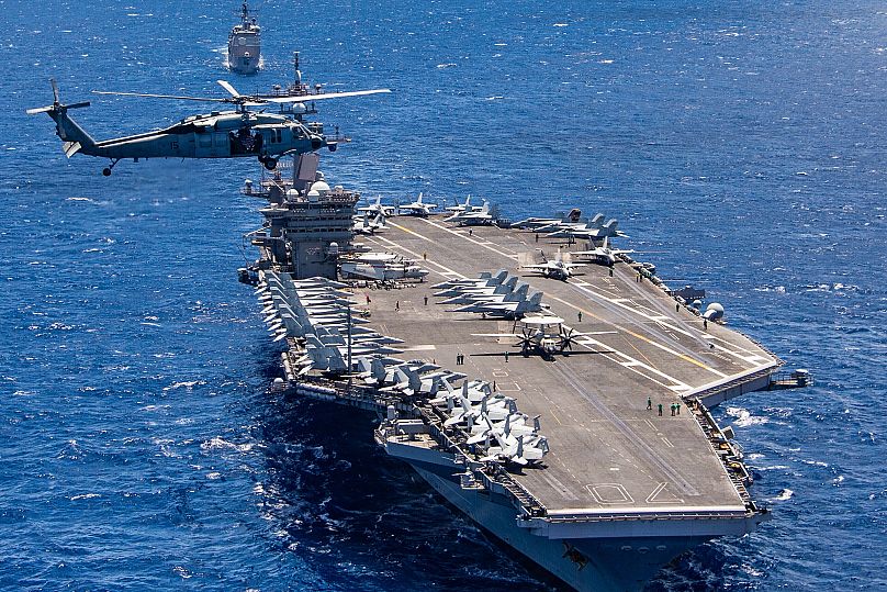 The USS Carl Vinson aircraft carrier participates in a group sail during the Rim of the Pacific exercise off the coast of Hawaii, 26 July, 2018