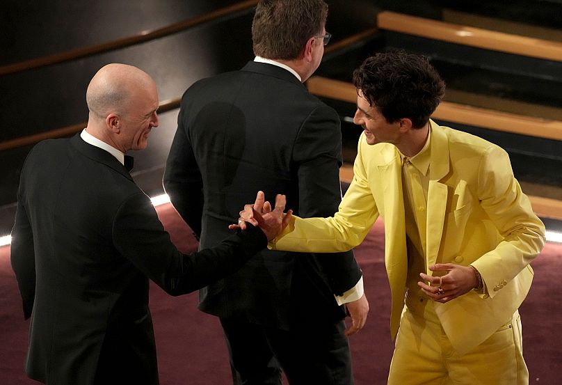 Timothee Chalamet wearing butter-yellow leather suit during the Oscars in March 2025