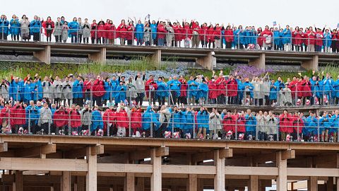 Participants sing Beethoven's "Ode to Joy" on the opening day of Osaka Expo 2025 in Osaka, western Japan, Sunday, April 13, 2025