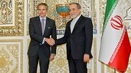 Foreign Minister Abbas Araghchi, right, shakes hands with the International Atomic Energy Agency (IAEA) Director General Rafael Mariano Grossi  in Tehran  April 16, 2025.