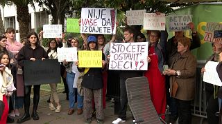 Protesters holding  banners including "Don`t betray Montenegro", "Don`t betray Long Beach", "Investor = Devastater"