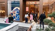 People shop at a Hermes store during the opening day of the luxury wing of the American Dream shopping mall in East Rutherford, New Jersey, 17 September 2021..