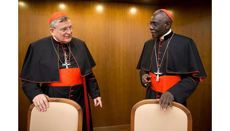 Cardinal Raymond Leo Burke, left, talks with Cardinal Robert Sarah in Rome