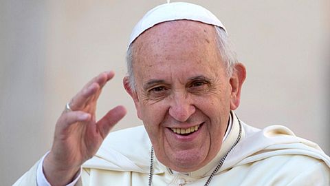 Pope Francis delivers his blessing as he arrives to hold his weekly general audience, in St. Peter's Square, at the Vatican, Wednesday, September 17, 2014.