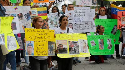 Relatives of Venezuelan migrants jailed in El Salvador protest outside the United Nations building in Caracas, Venezuela, Tuesday, April 22, 2025.