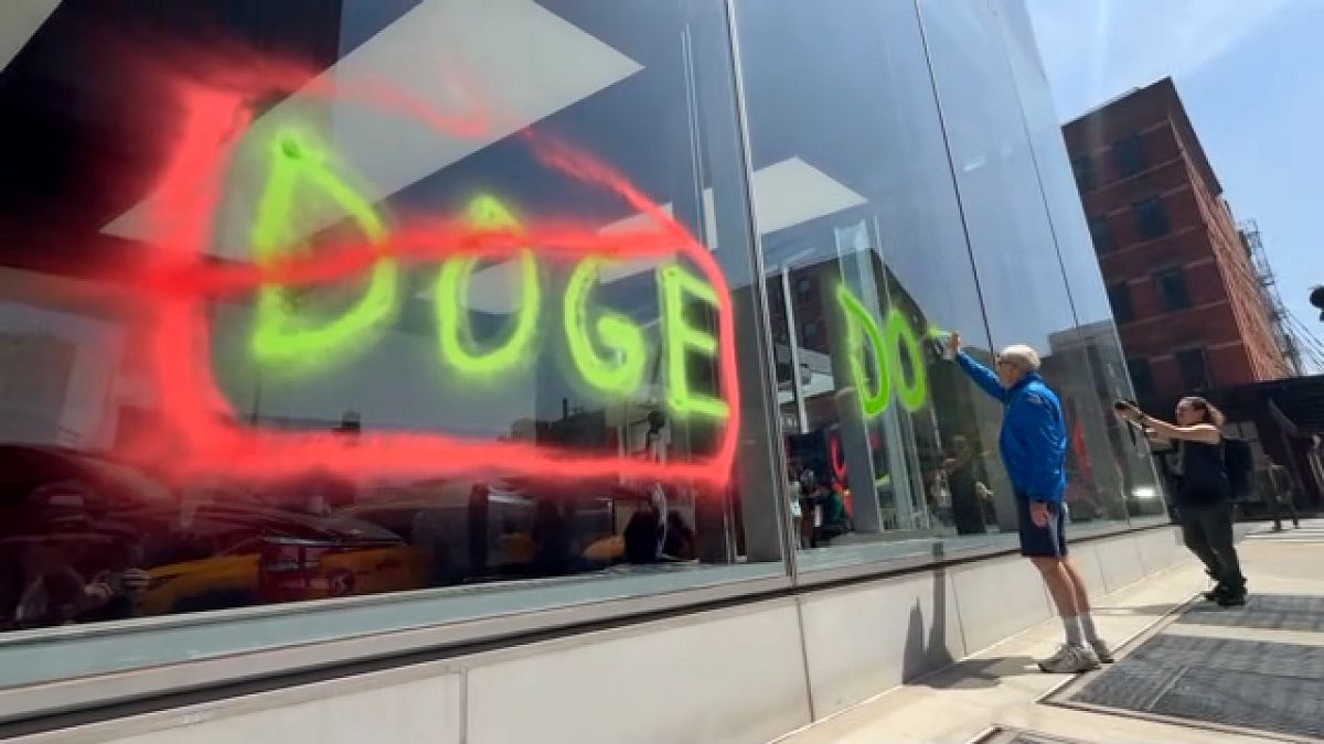 Extinction Rebellion stages Earth Day protest outside Tesla showroom