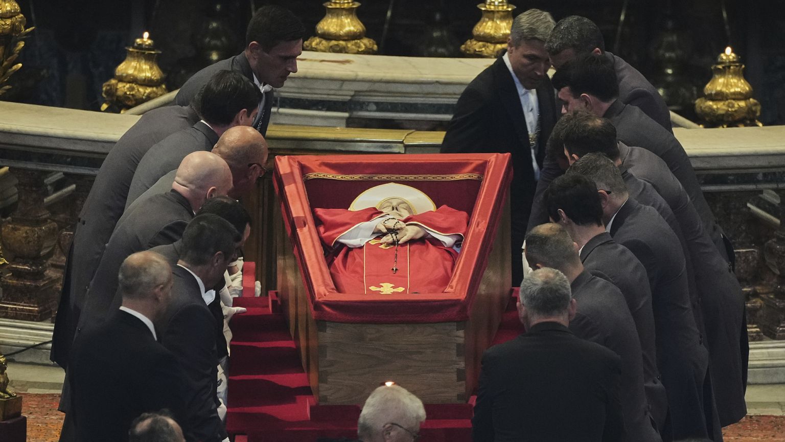 Pallbearers place the body of Pope Francis inside St Peter's Basilica at the Vatican, 23 April, 2025 