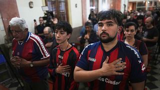 Fans of San Lorenzo soccer club attend a Mass at San Antonio Parish in honor of the late Pope Francis, a lifelong supporter of the club, in Buenos Aires, Argentina, 23.04.2025