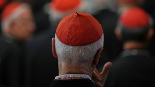 Cardinals sit inside St. Mary Major Basilica ,in Rome, Sunday, April 27, 2025. 