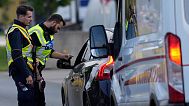 FILE - German federal police officers check cars at the Austrian-German border crossing point in Kiefersfelden, Germany, Monday, Oct. 9, 2023.