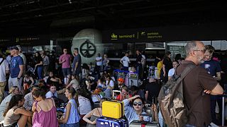 Thousands of travellers were left stranded, with some spending the night on airport floors.