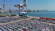FILE An aerial view of new cars waiting for shipment at a pier for ro-ro ships in Yantai city in eastern China's Shandong province, 30 March 2025