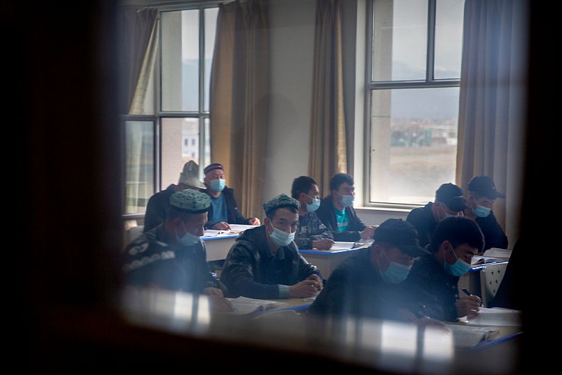 Students training to become imams recite verses from the Quran at the Xinjiang Islamic Institute in Urumqi, 21 April, 2021