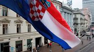FILE: The flags of Croatia and EU fly over the Ban Jelacic square in Zagreb, 4 October 2005