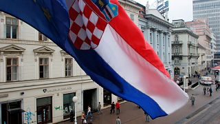 FILE: The flags of Croatia and EU fly over the Ban Jelacic square in Zagreb, 4 October 2005