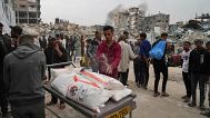 Palestinians receive bags of flour and other aid distributed by UNRWA in Jabaliya, 1 April, 2025