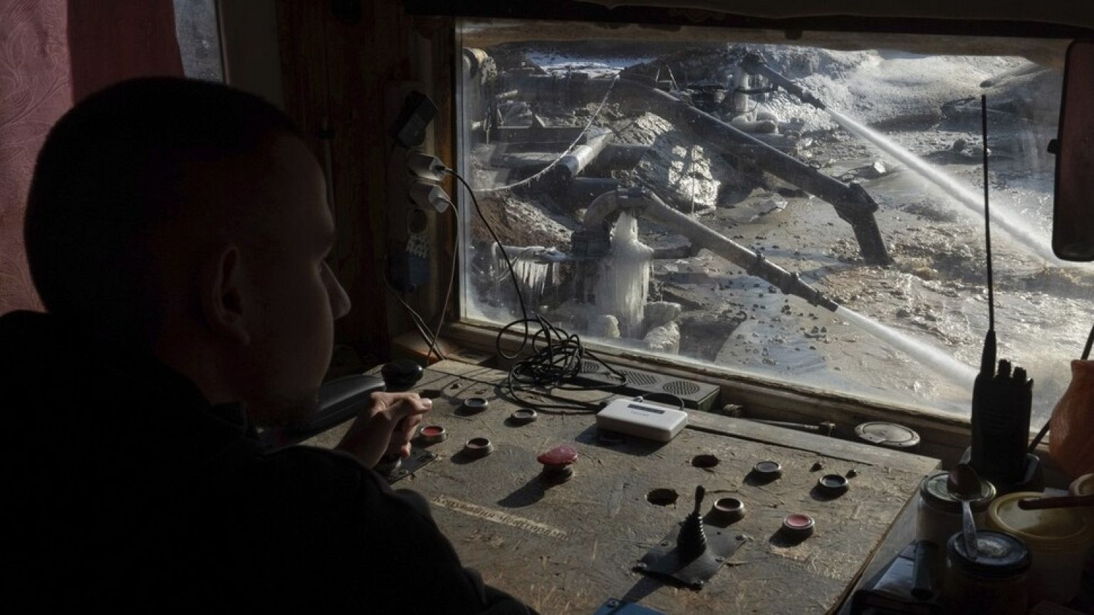 A worker controls extraction of ilmenite, a key element used to produce titanium, in an open pit mine in the central region of Kirovohrad, Ukraine, Wednesday, Feb 12, 2025