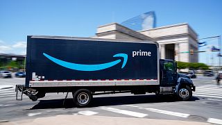 FILE - An Amazon truck drives in in Philadelphia, Friday, April 30, 2021.