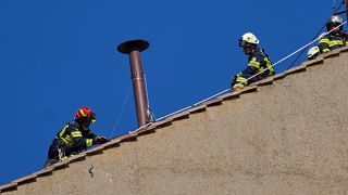 Vatican firefighters install chimney on top of Sistine Chapel ahead of conclave