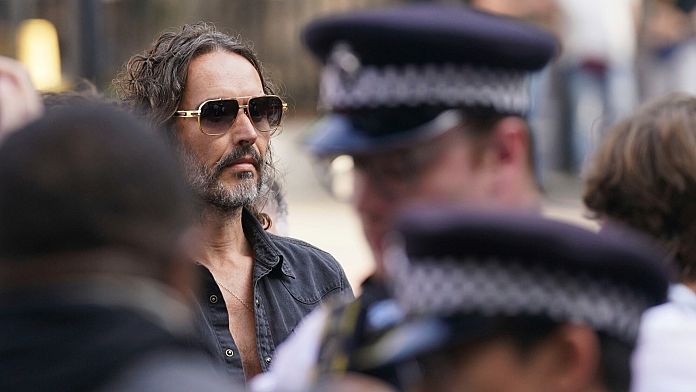 Russell Brand granted conditional bail after appearing in London court on rape and assault charges