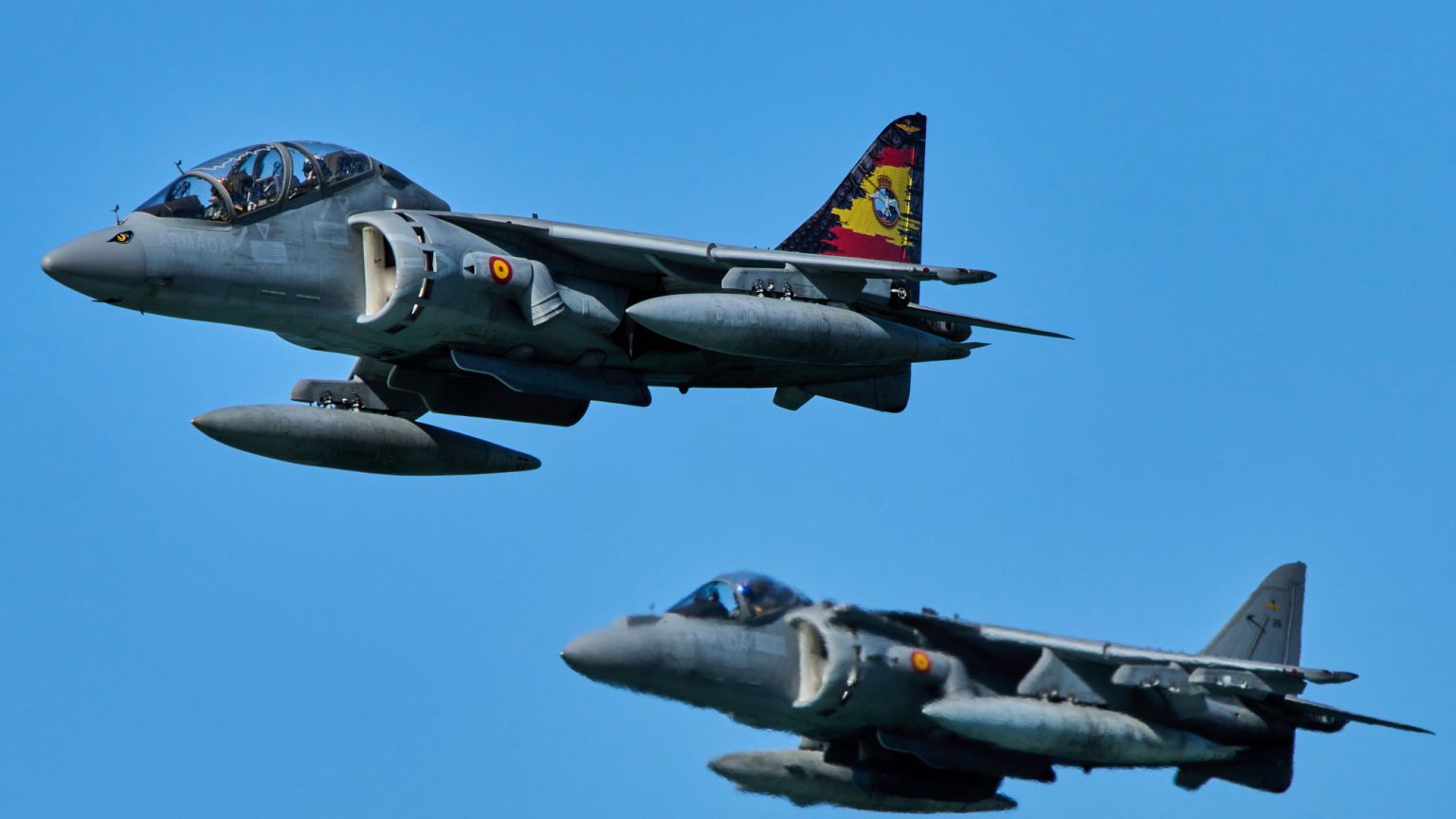 Two Spanish Navy's AV-8B Harrier II fighter jets fly as part of the NATO Dynamic Mariner/Flotex-25 naval exercise in Barbate, southern Spain, on March 28, 2025.