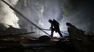 A rescuer works on a site of a residential building destroyed by a Russian strike in Zaporizhzhia, 1 May, 2025